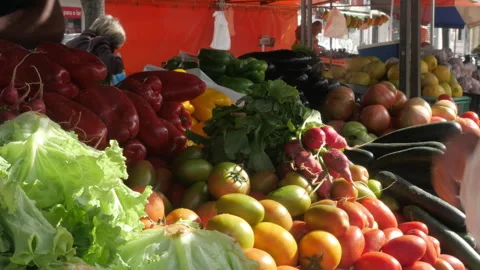 Shopper Selecting Fresh Vegetables at Outdoor Market Stall, Zoom In Stock Footage 335454346