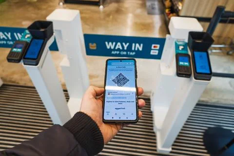 Shopper using Amazon mobile app to scan and pay at Amazon store. London, UK, 17 Stock Photos