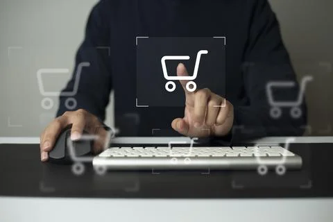 Shopper using computer and touch virtual screen online shopping. And online p Stock Photos
