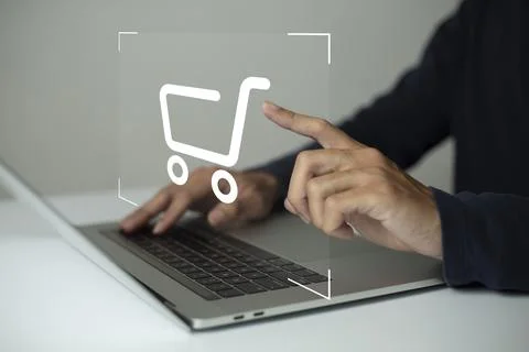 Shopper using laptop and touch virtual screen online shopping. And online pay Stock Photos