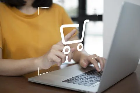Shopper using laptop and touch virtual screen online shopping. And online pay Stock Photos