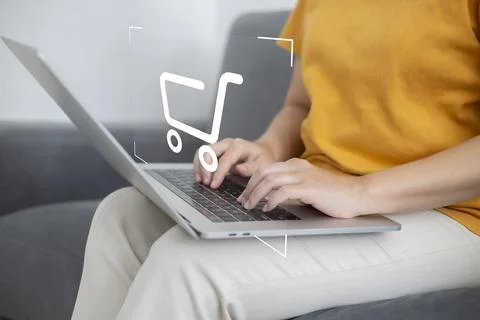 Shopper using laptop and touch virtual screen online shopping. And online pay Stock Photos