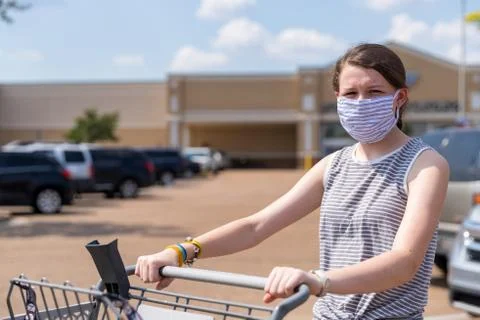 Shopper wears face mask while shopping during a pandemic Stock Photos