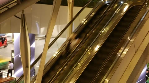 Shoppers and Commuters Riding Escalator Up to BTS Skytrain 스톡 동영상 339067539