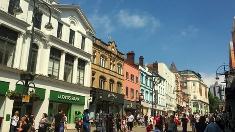 Shoppers in Briggate in Leeds, West Yorkshire, England Stock Footage