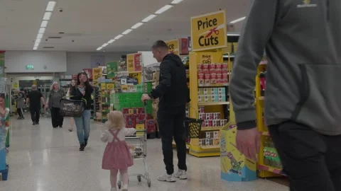 Shoppers Browsing Aisles Inside a Supermarket as staff shift work Video stock 335883080
