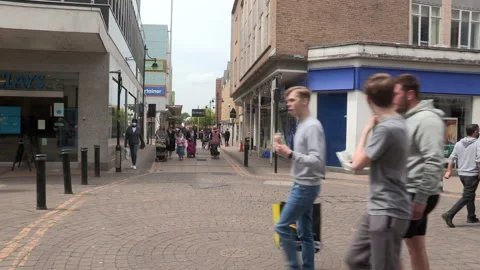 Shoppers in a crowded street Stock Footage