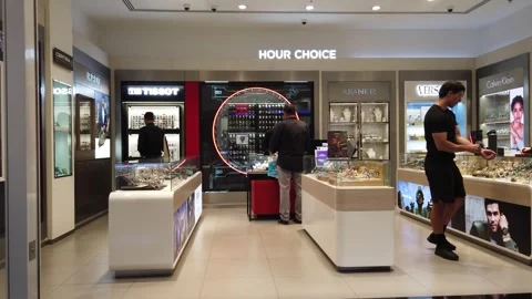 Shoppers explore luxury brand stores inside Dubai Mall of the Emirates, brows Video stock 312334174