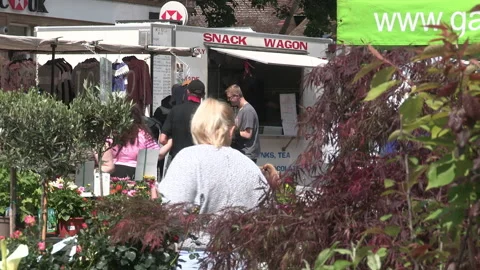 Shoppers at a flower stall Video stock 155884950