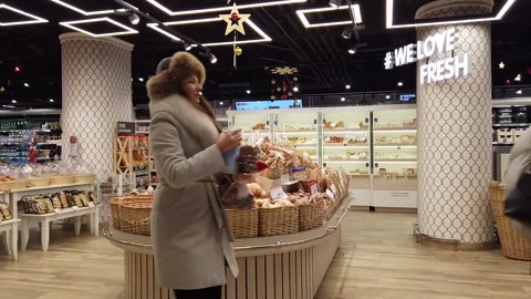 Shoppers in the fresh baked goods section of the supermarket. Stock Footage 150921973