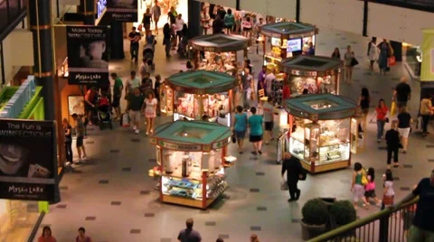Shoppers mill around kiosks Stock Footage 7763689