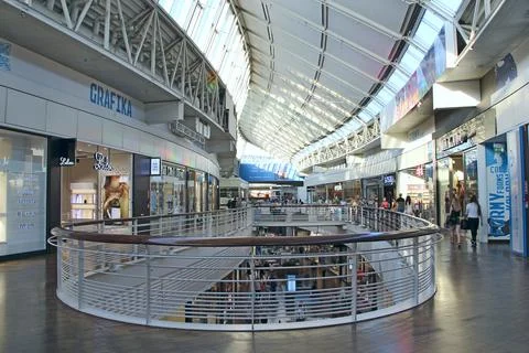 Shoppers at multilevel shopping center. architectural design inside hypermark Stock Photos