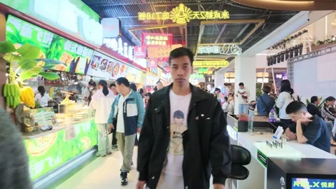 Shoppers in the Optics Valley Square district in Wuhan 스톡 동영상 347179232