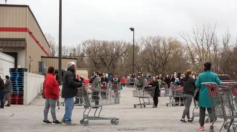 Shoppers Practicing Physical Distancing While Lining Up Outside Costco Store Stock Photos
