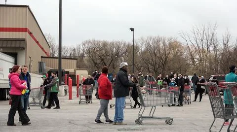 Shoppers Practicing Physical Distancing While Lining Up Outside Costco Store Stock Photos