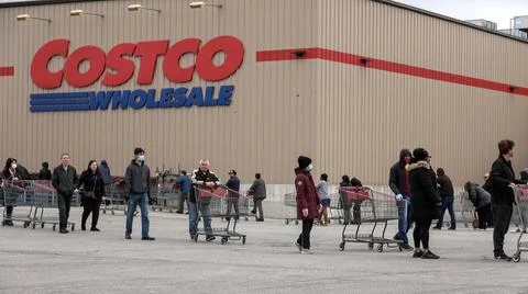 Shoppers Practicing Physical Distancing While Lining Up Outside Costco Store Stock Photos