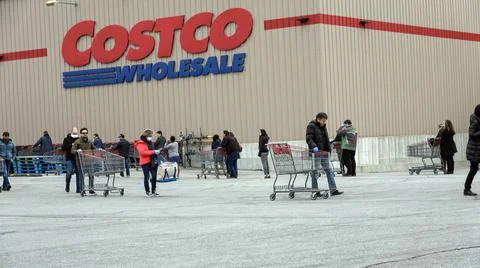 Shoppers Practicing Physical Distancing While Lining Up Outside Costco Store Stock Photos