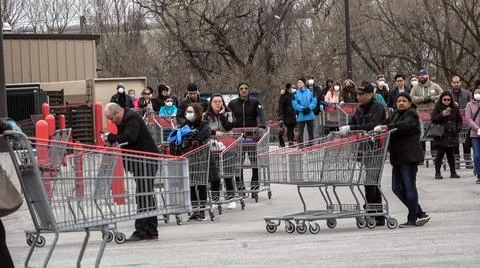 Shoppers Practicing Physical Distancing While Lining Up Outside Costco Store Stock Photos