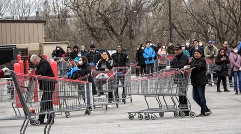 Shoppers Practicing Physical Distancing While Lining Up Outside Costco Store Stock Photos