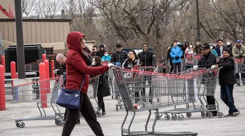 Shoppers Practicing Physical Distancing While Lining Up Outside Costco Store Stock Photos