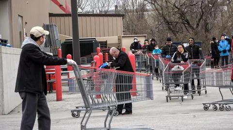 Shoppers Practicing Physical Distancing While Lining Up Outside Costco Store Stock Photos