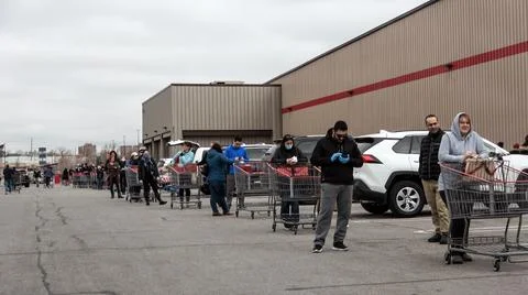 Shoppers Practicing Physical Distancing While Lining Up Outside Costco Store Stock Photos