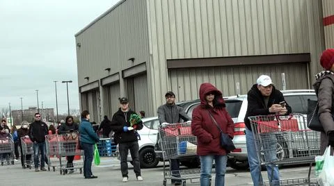 Shoppers Practicing Physical Distancing While Lining Up Outside Costco Store Stock Photos