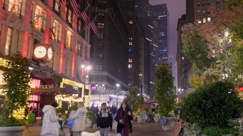 Shoppers On The Streets In Front Of Macy's Department Store Decorated With Stock Footage 323910212