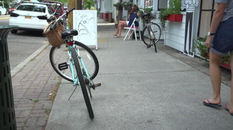 Shoppers stroll down a sidewalk Stock Footage 67383118