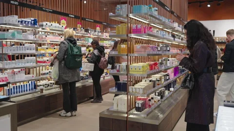 Shoppers testing perfumes and choosing products to buy. Minsk, Belarus, 2023 Stock-Footage 239906070