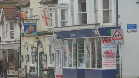 Shoppers, Tourists and traffic within the High Street, Whitstable, Kent Stock Footage 88412435