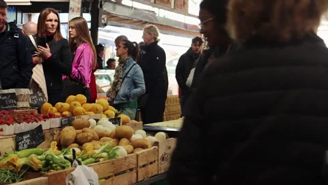 Shoppers Walk By Fruit And Vegetable Market Stalls In Antibes, France, medium Stock Footage 331621220