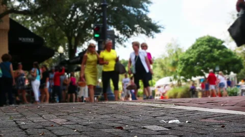 Shoppers walk in a small town Stock Footage 55870663