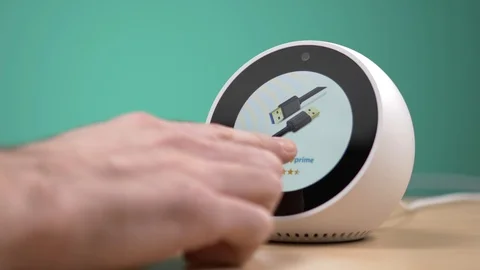 Shopping on Amazon on a Echo Spot Smart Assistant Screen Stock Footage 101910316
