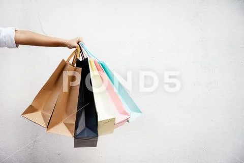 Shopping bags of women crazy shopaholic person at shopping mall.colorful pape Stock Photos