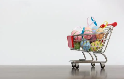 Shopping basket with Easter eggs Stock Photos