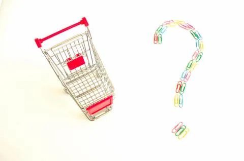 Shopping cart and question mark made of colourful paper clips Stock Photos