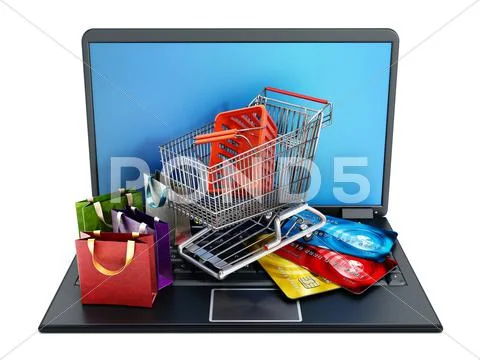 Shopping Cart, Credit Cards And Bags Standing On Laptop Computer.