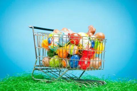 Shopping Cart With Easter Eggs Stock Photos