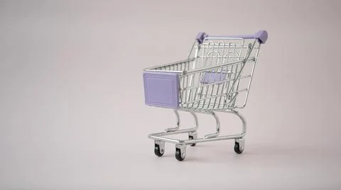 Shopping cart. Empty cart on a solid background. Concept Stock Photos