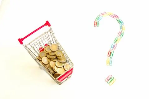 Shopping cart full of coins and question mark made of colourful paper clips Stock Photos