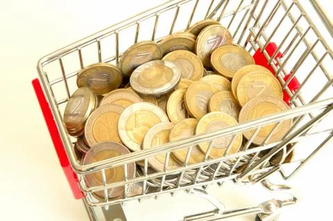Shopping cart full of coins Stock Photos