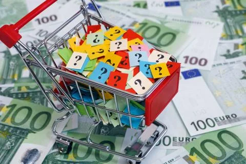 Shopping cart with question marks on one hundred euro banknotes Stock Photos