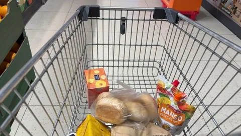 Shopping Cart in Store with Sharp Focus on Cart and Blurred Background Stock Footage 277104873