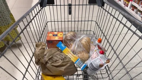 Shopping Cart in Store with Sharp Focus on Cart and Blurred Background Stock Footage 277104875