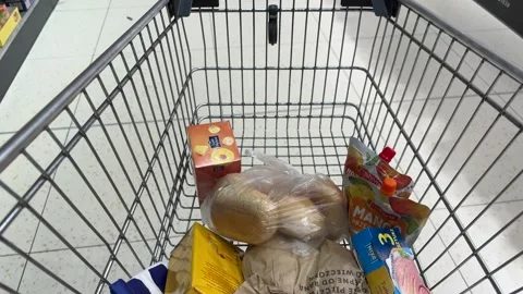 Shopping Cart in Store with Sharp Focus on Cart and Blurred Background Stock Footage 277104877