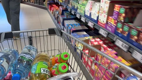 Shopping Cart in Store with Sharp Focus on Cart and Blurred Background Stock Footage 277105291