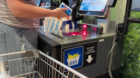 Shopping Cart in Store with Sharp Focus on Cart and Blurred Background Stock Footage 277105320