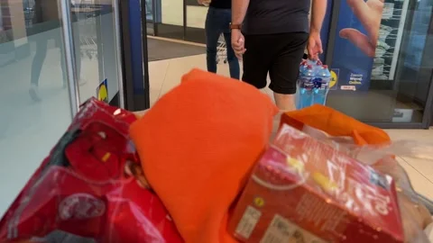 Shopping Cart in Store with Sharp Focus on Cart and Blurred Background Stock Footage 277105336