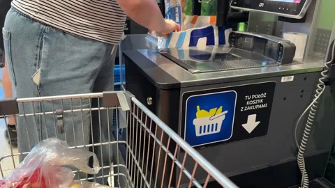 Shopping Cart in Store with Sharp Focus on Cart and Blurred Background Stock Footage 277105349